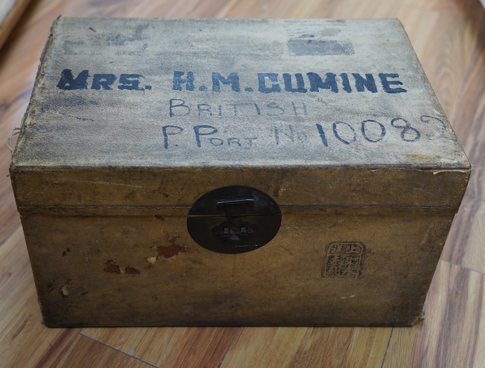 A vellum bound trunk, Chinese label to interior, 42cm wide, 24.5cm high. Condition - poor